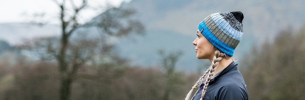waterproof hat model in mountains blue