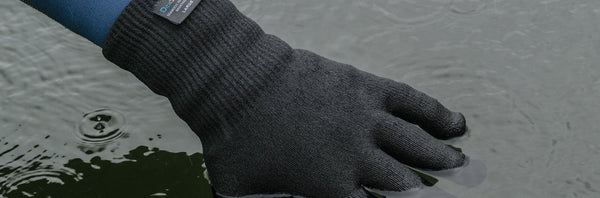 waterproof gloves black in puddle